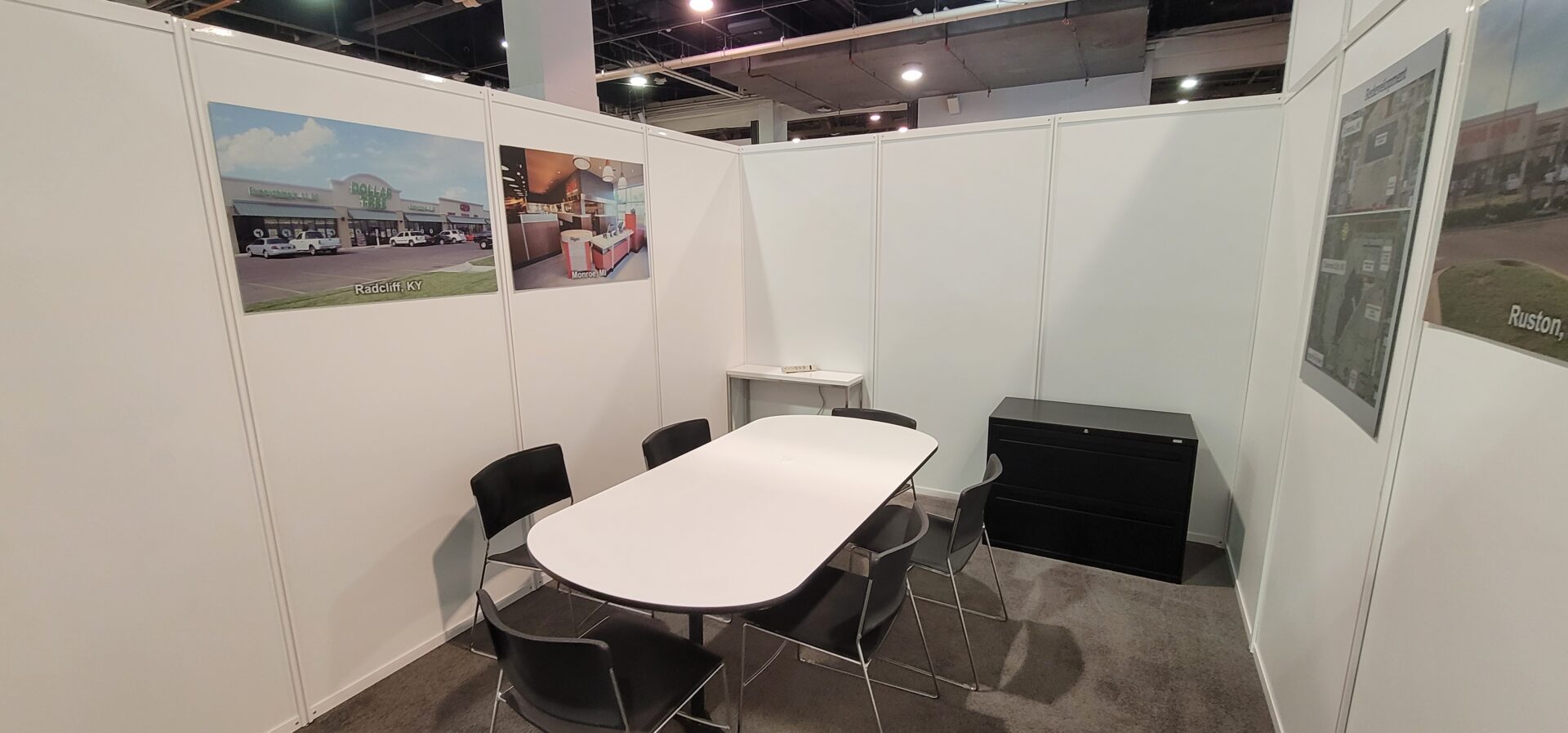 A white table with black chairs